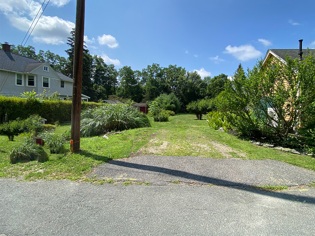 A view looking from the Curb cut down the lot.